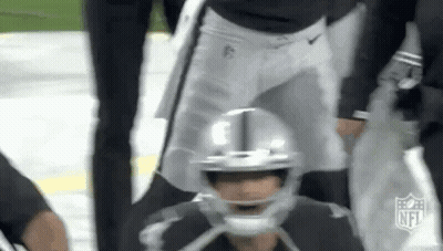 Football Player Sitting On Field During Game GIF