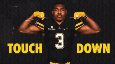 Football Player Standing In Front Of Tough Down Sign GIF