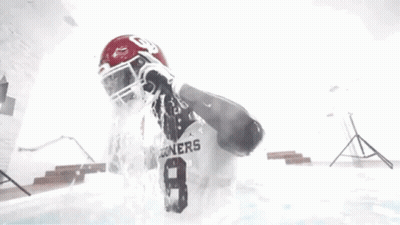 Football Player Standing In Pool With Water Pouring On Head GIF