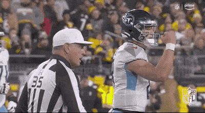 Football Player Standing Next To Referee GIF