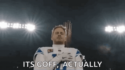 Football Player Standing With Hands Folded In Front Of Fireworks GIF
