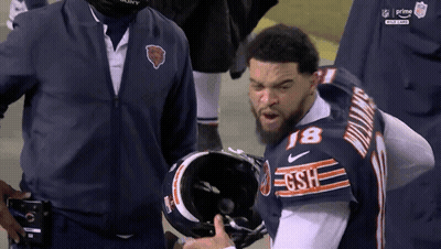 Football Player Stands On Field Saying That Playful GIF