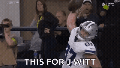 Football Player Tackled By Fan Holding Football GIF