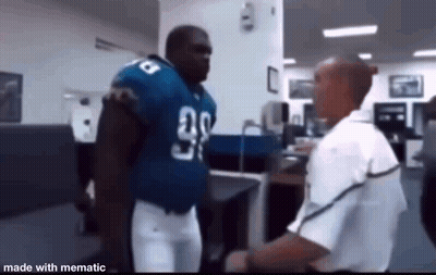 Football Player Talking To Man In White Shirt In Office GIF