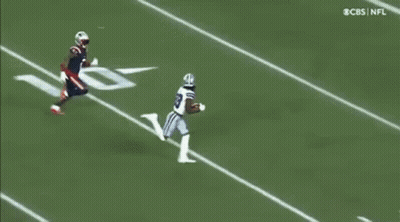 Football Player Trying To Catch Ball While Being Tackled GIF