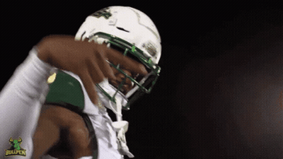 Football Player Wearing Bullpen Helmet GIF