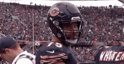 Football Player Wearing Helmet With G GIF