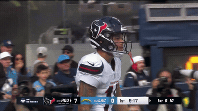Football Player Wearing Helmet With Hou
