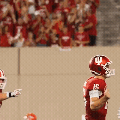 Football Player Wearing Helmet With Letter I GIF