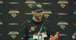 Football Player Wearing Ugly Sweater GIF