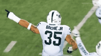Football Player With Bachie Jr On Back GIF