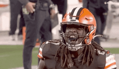 Football Player With Dreadlocks In Helmet GIF