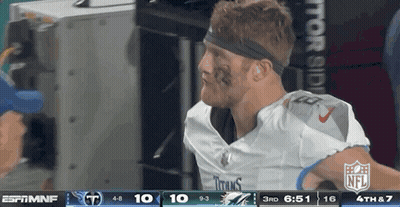 Football Player With Headband In Front Of NFL Scoreboard GIF