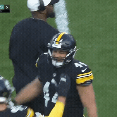 Football Player With Helmet And Coach Behind GIF