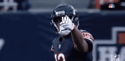 Football Player With Helmet And Letter W On Hand GIF