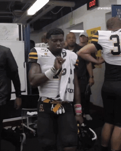 Football Player With Jersey Number 3 In Locker Room GIF