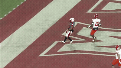 Football Player With Letter M On Jersey Holding Ball GIF