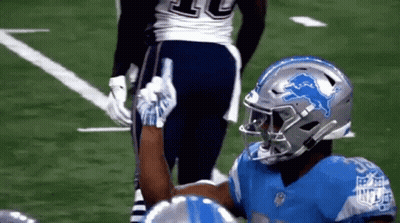 Football Player With Lion Helmet High-Fiving Another Player GIF