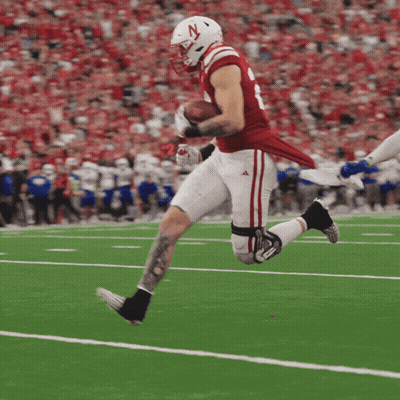 Football Player With N Helmet Running With Ball GIF