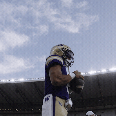 Football Player With W On Shorts Holding Ball GIF