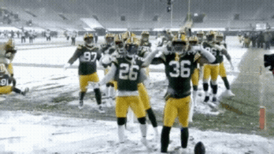 Football Players 26 And 36 On Snowy Field GIF