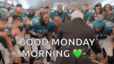 Football Players Dancing In Front Of Suited Man GIF