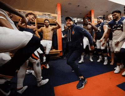 Football Players Dancing In Locker Room GIF