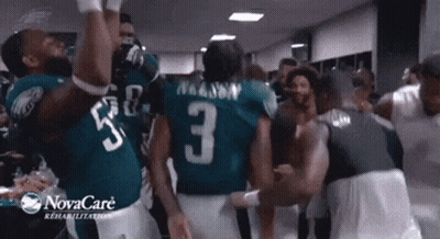Football Players Dancing In Locker Room Sponsored By Novacare GIF