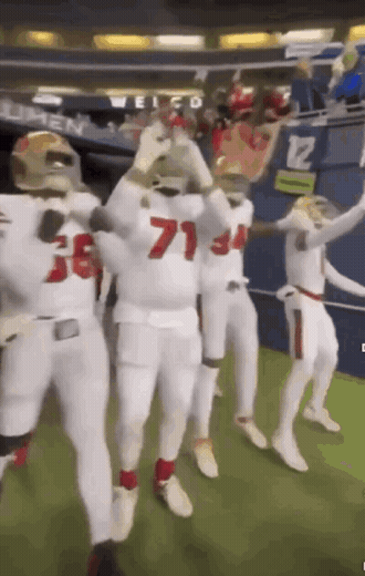 Football Players Dancing In Stadium GIF