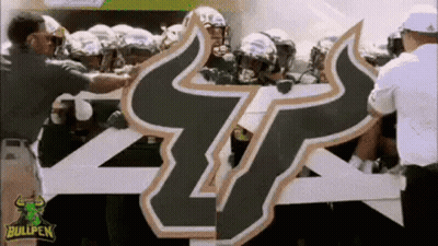 Football Players Holding Bullpen Sign