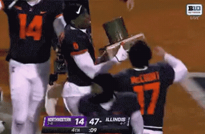 Football Players Holding Trophy In Stadium GIF