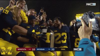Football Players Holding Trophy With Number 23 GIF