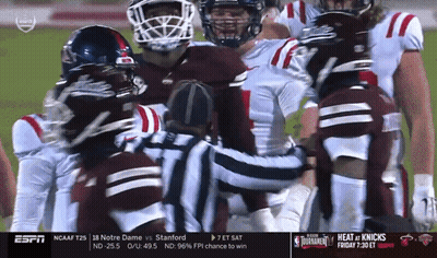 Football Players Huddle Around Referee ESPN GIF