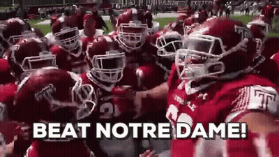 Football Players Huddled Saying Beat Notre Dame GIF
