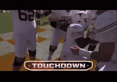 Football Players Huddled Saying Touchdown GIF