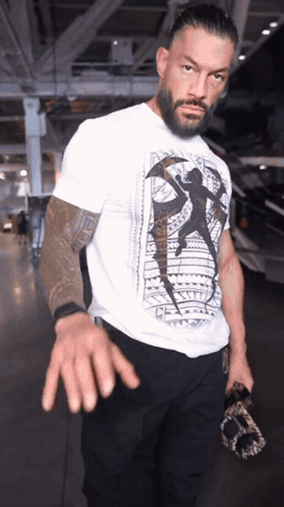 Football Players Huddled Together Saying Touchdown GIF