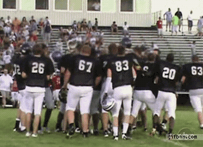 Football Players Huddled With 63 Jersey GIF