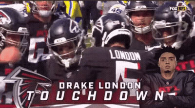 Football Players Huddled With Drake London GIF