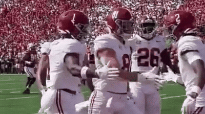 Football Players Hugging On Field GIF