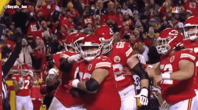 Football Players Hugging On Field GIF