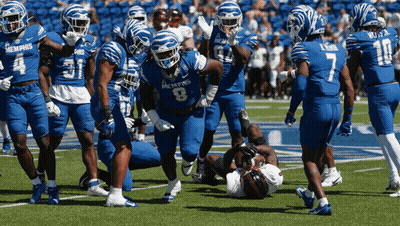 Football Players in Blue Memphis Uniforms