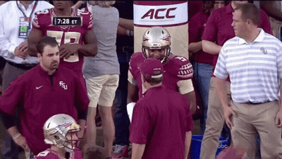 Football Players In Front Of ACC Banner GIF