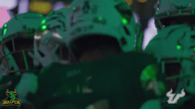 Football Players in Green Uniforms Bullpen