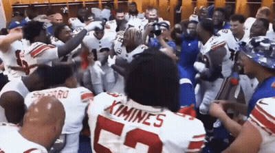Football Players In Locker Room With Number 52 Jersey GIF