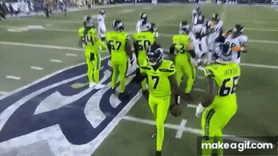 Football Players In Neon Green Uniforms GIF