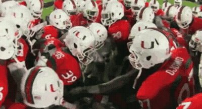 Football Players In Red And White Uniforms Huddled GIF