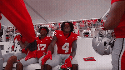 Football Players In Red Jerseys Number 4 GIF