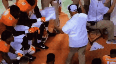 Football Players Listening To Coach In Locker Room GIF