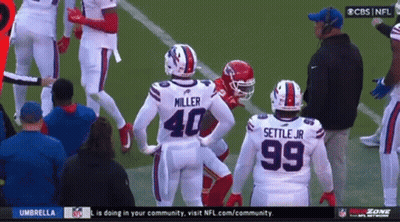 Football Players Miller 40 And Settle Jr 99 On Field GIF