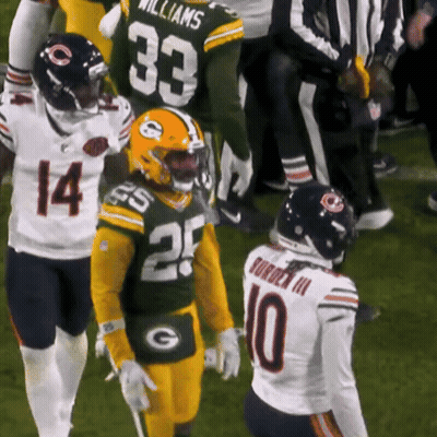 Football Players Number 10 And 33 Talking GIF